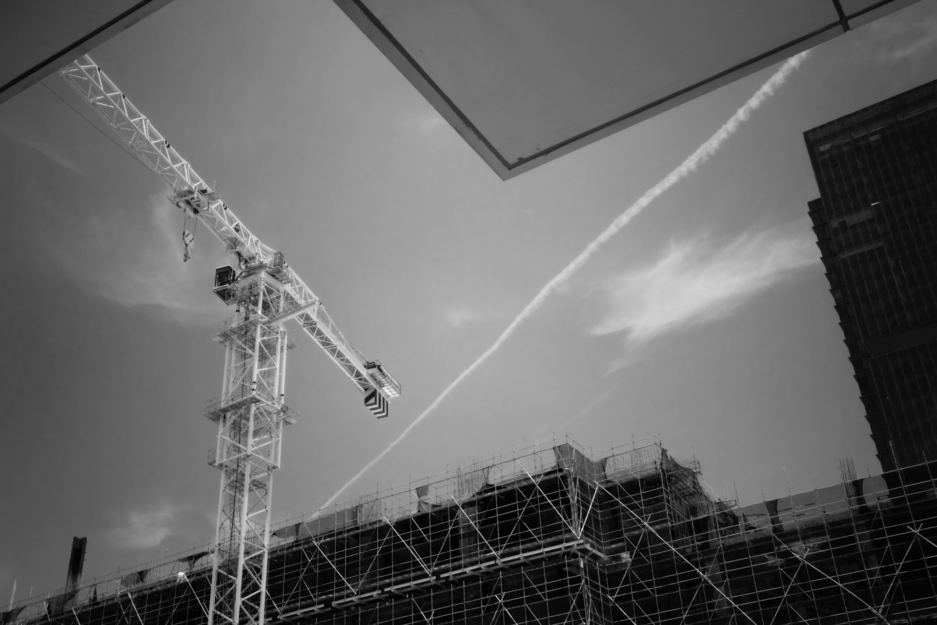 Construction crane against a cloudy sky